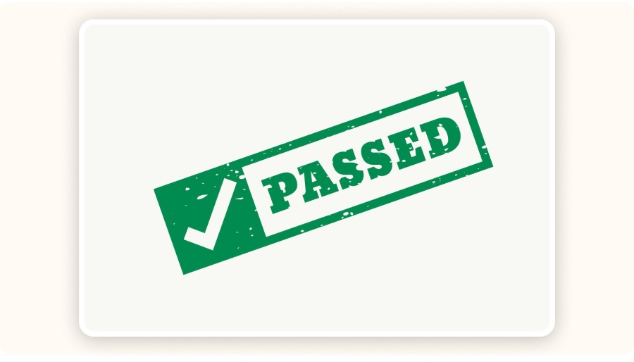 Green passed stamp with checkmark symbol indicating approval or validation&nbsp;