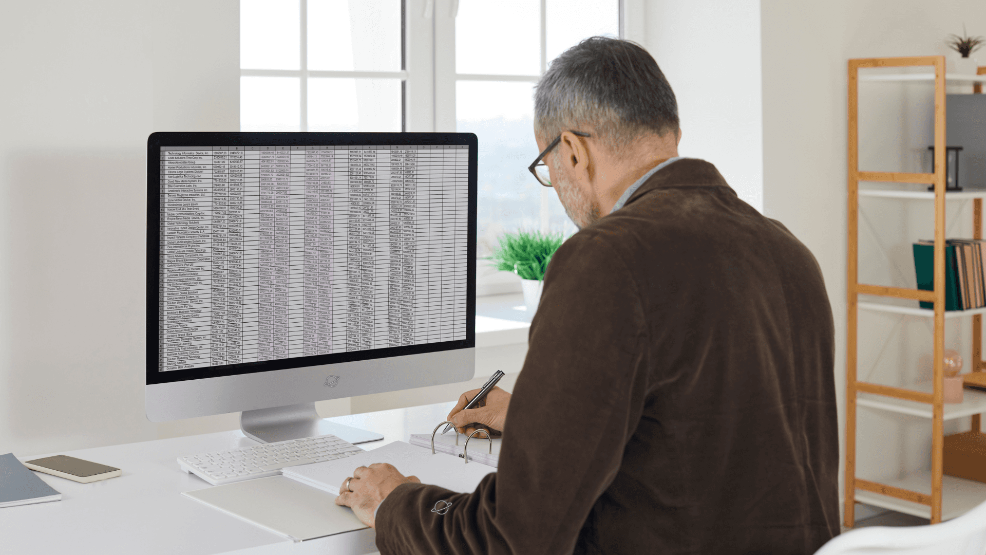 Man working on spreadsheets