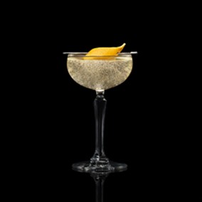 A closeup of a NEFT Nouvel drink against a dark background.