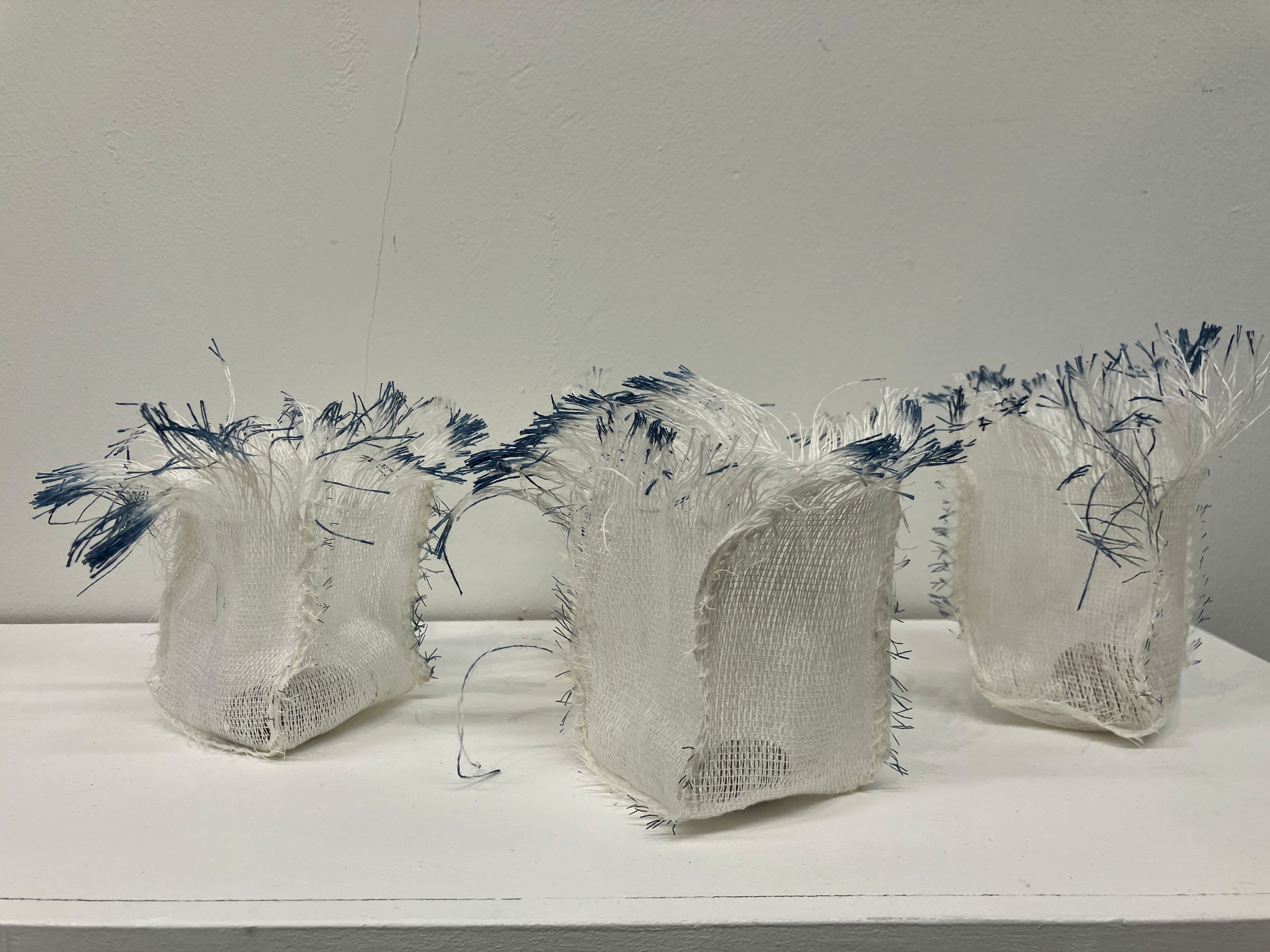 A patterned vase sitting on a table