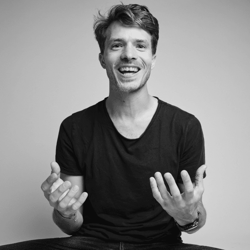 Vast forest landscape under a soft, cloudy sky.