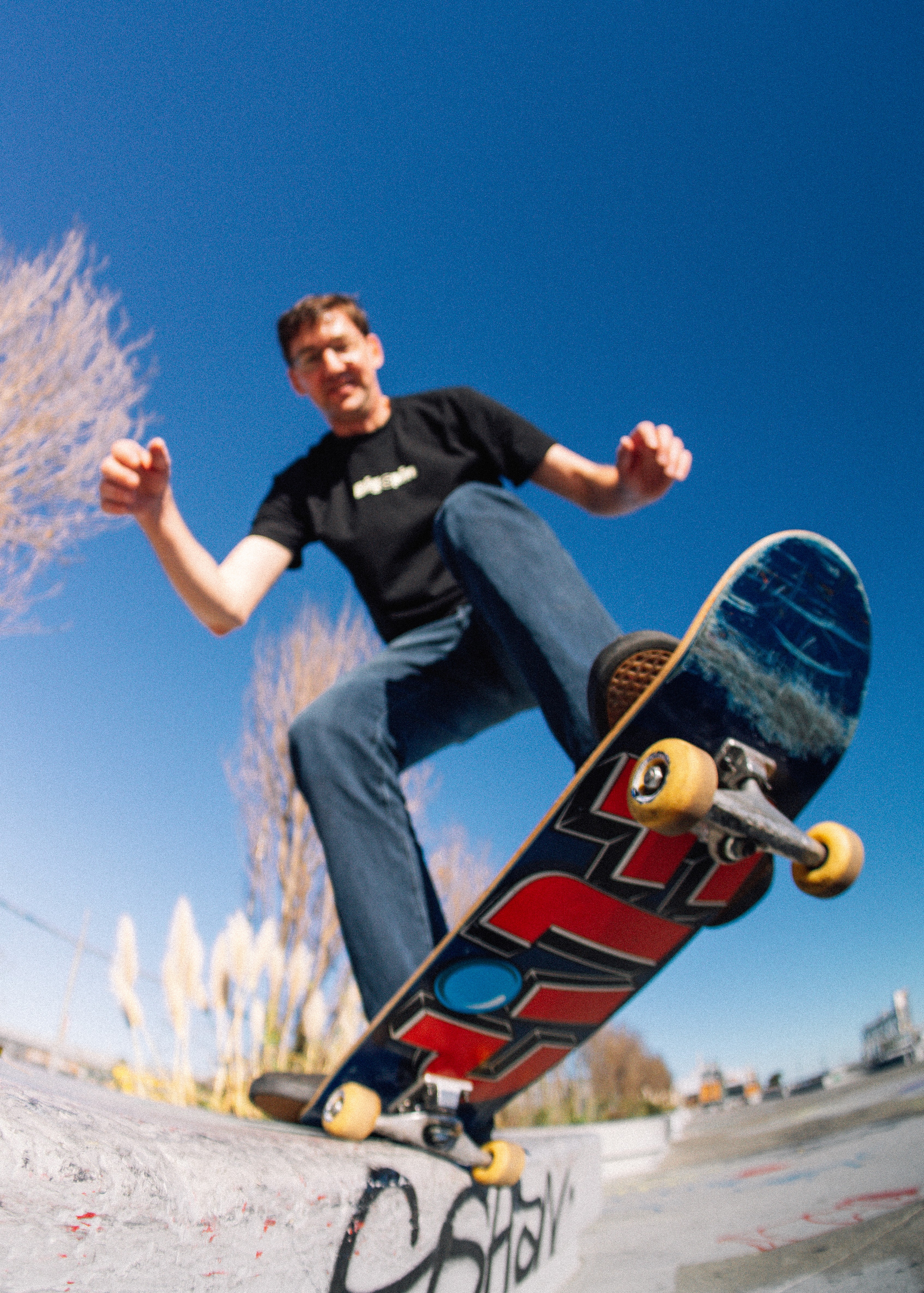 David, founding engineer, working on a laptop outdoors in a skatepark