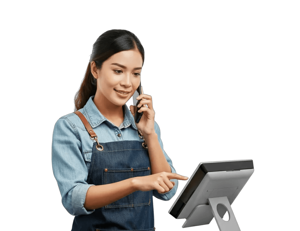 A woman on a phone call tapping the screen of a point of sale terminal