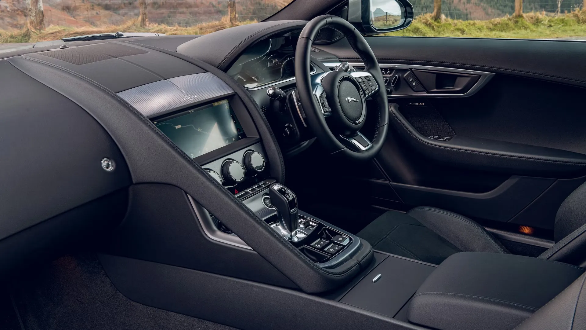 Modern car interior with black upholstery and a sleek center console