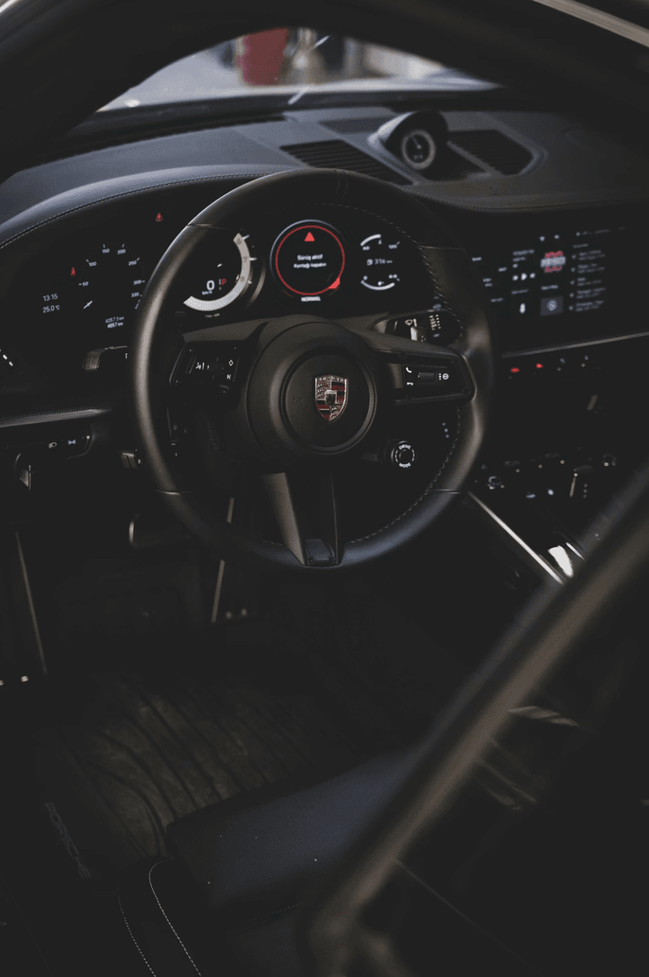 woman sitting around table holding tablet