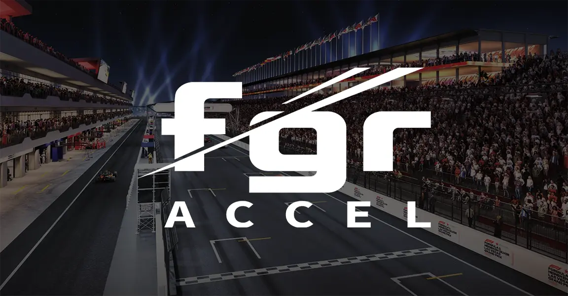 Crowded nighttime motorsports race track with bright stadium lights and grandstands full of fans, featuring a large white fgr ACCEL logo overlay in the center of the image.