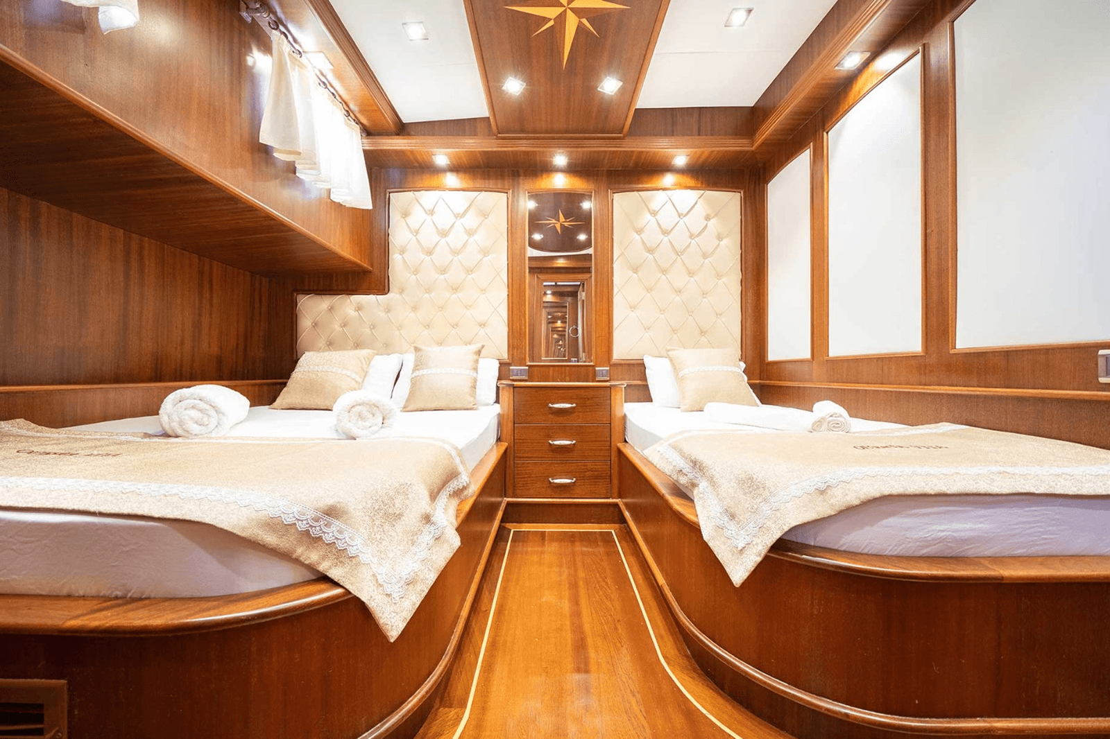 A green butterfly rests on a flower.