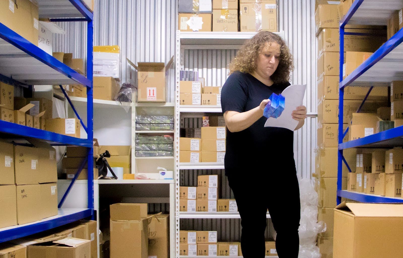 Employee reviewing documents in a commercial storage facility