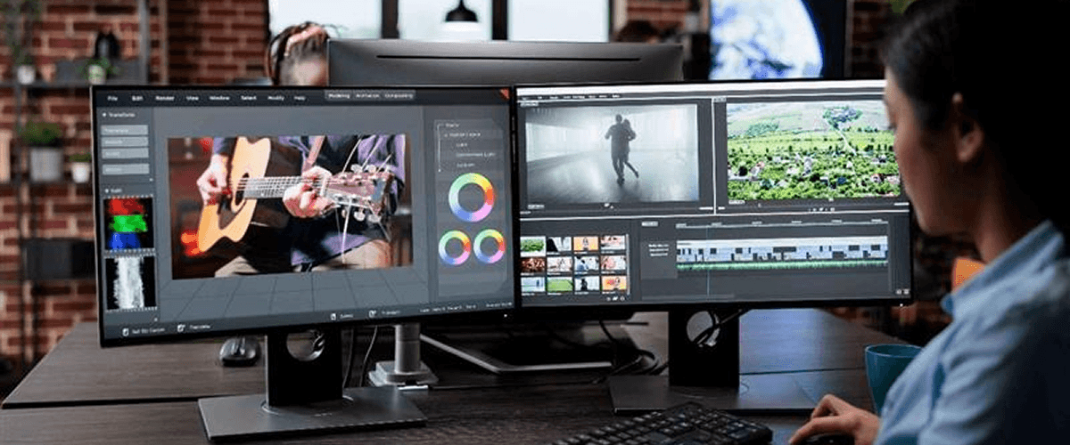 A video editor using a multi-monitor setup to create a motion graphics-heavy video, representing the role of motion graphics in product videos.