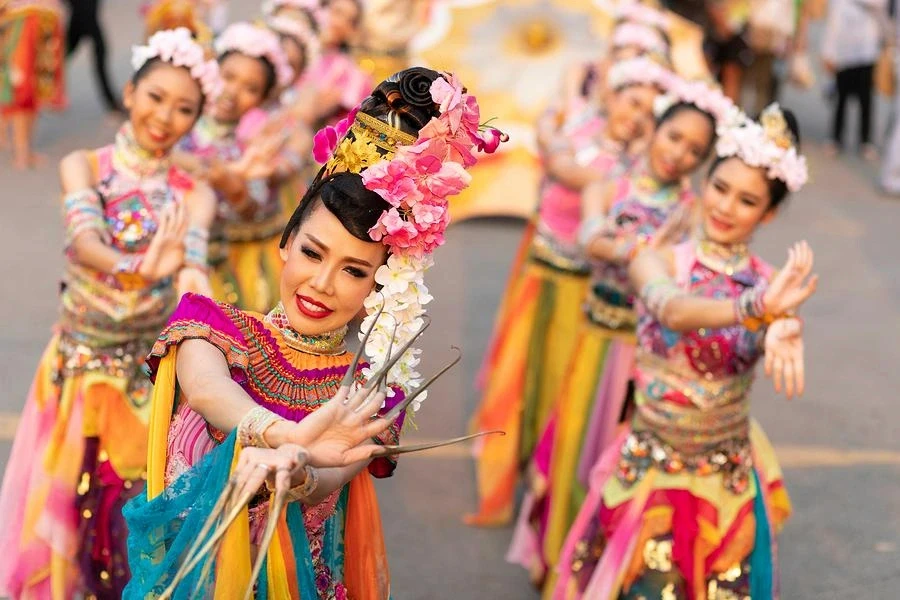 Traditional Thai dancers performing outdoors.
