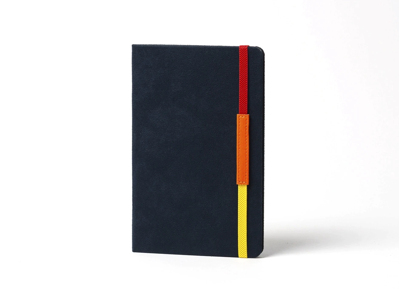 Standing dark blue notebook with vertical red, orange, and yellow strap.