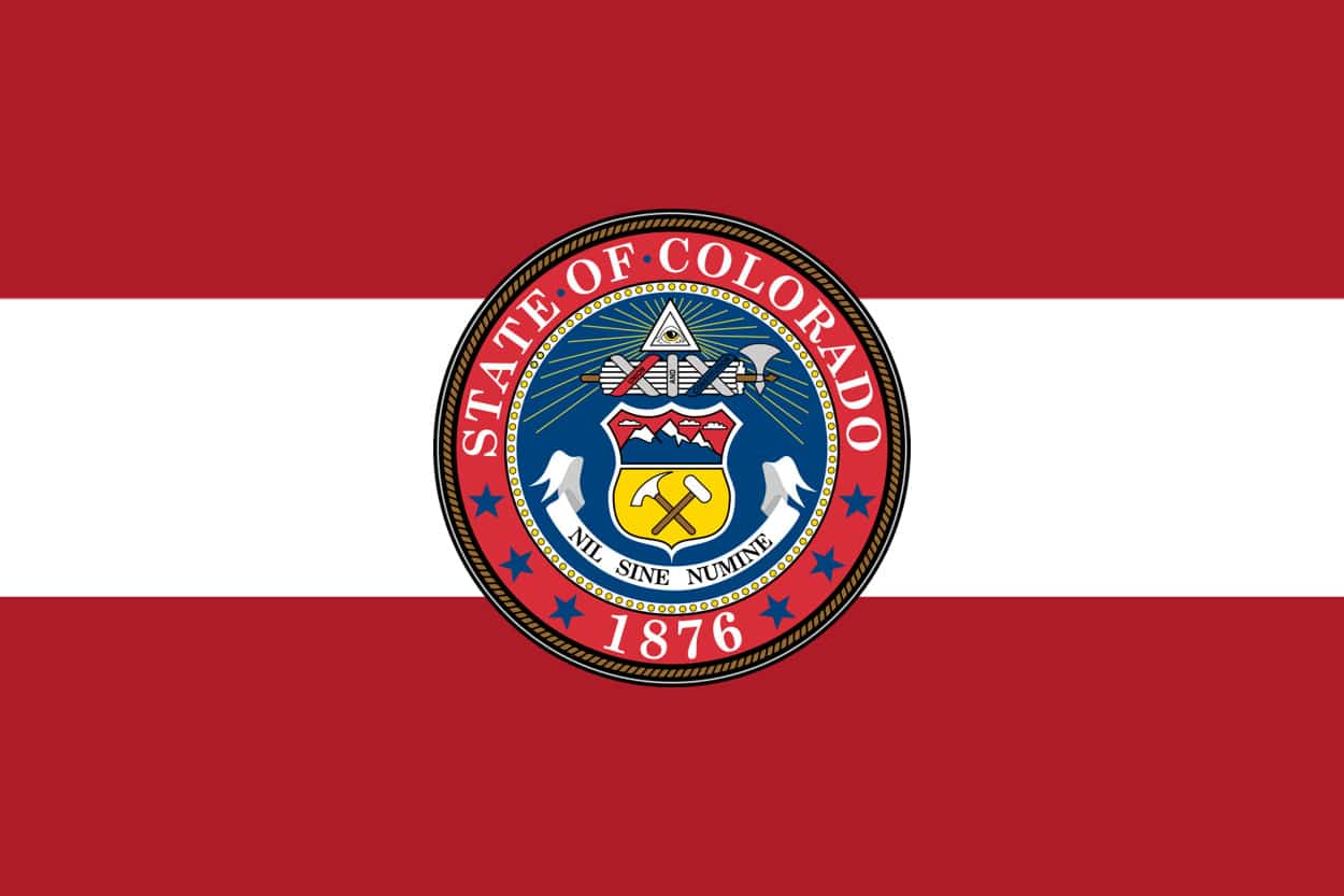 A gavel and scales in a courtroom signify that this article discusses laws and regulations established by the government