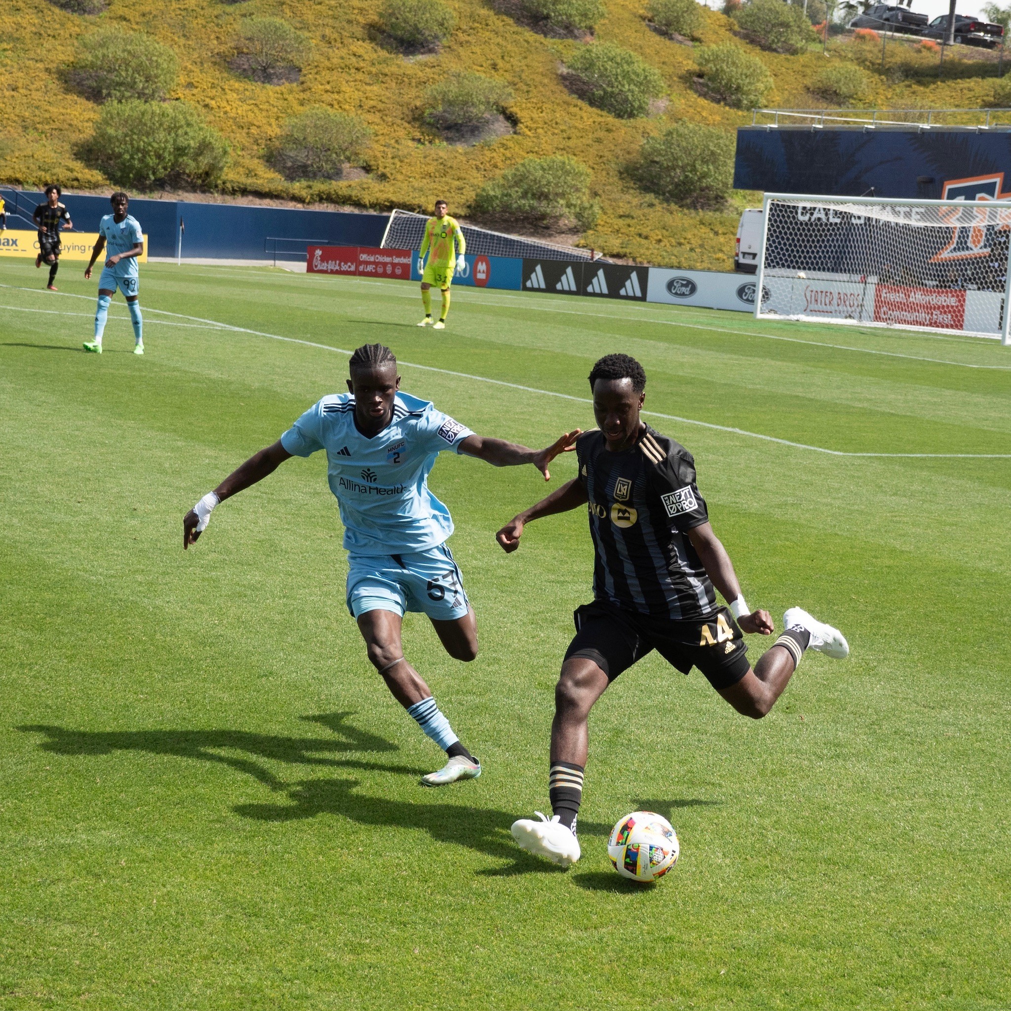 Kicking Ball With Attacker Close At LAFC Home Game