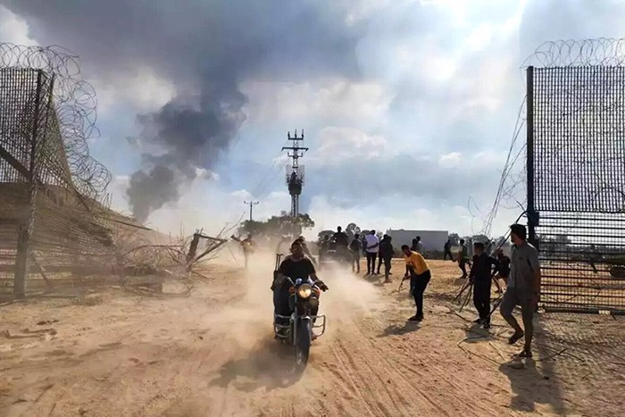 Terrorists breach the Gaza border fence on Oct. 7, 2023. Photo courtesy of Israel Hayom.
