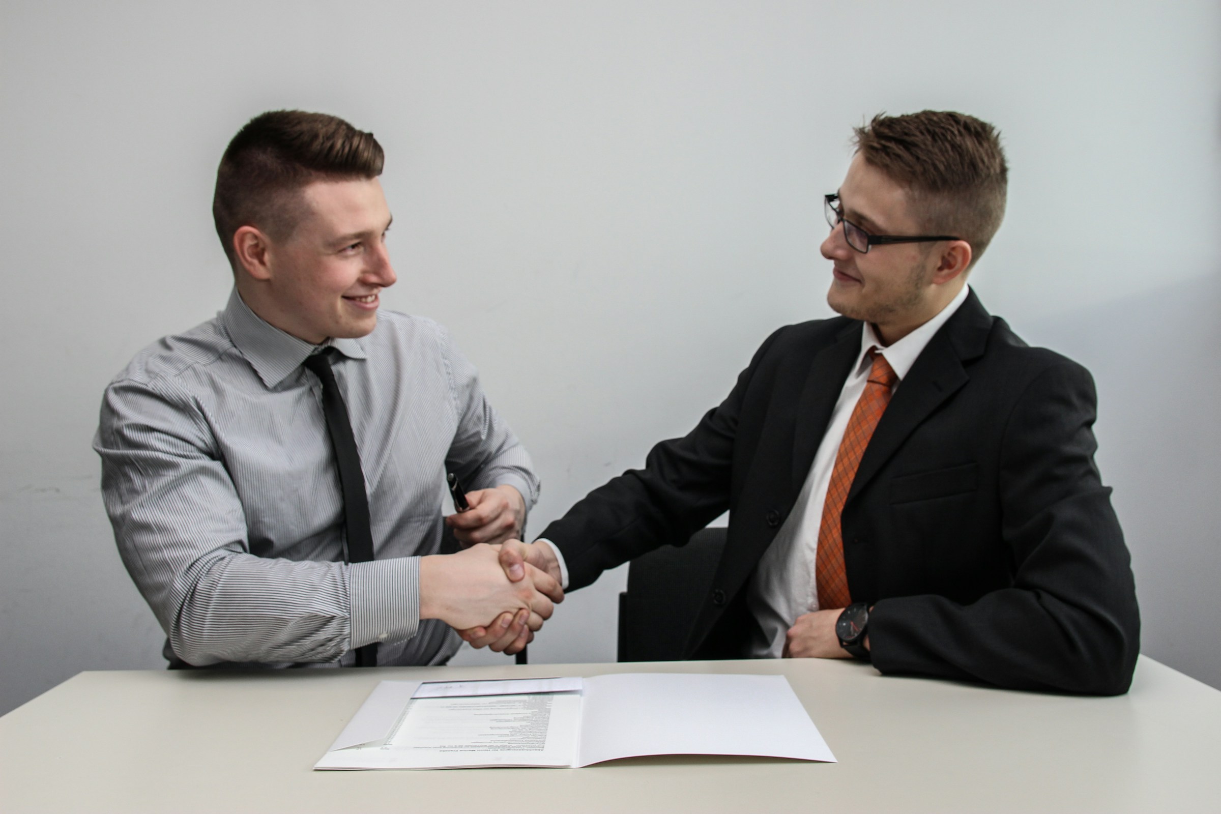 person hand shaking - Music Producer Contract Template