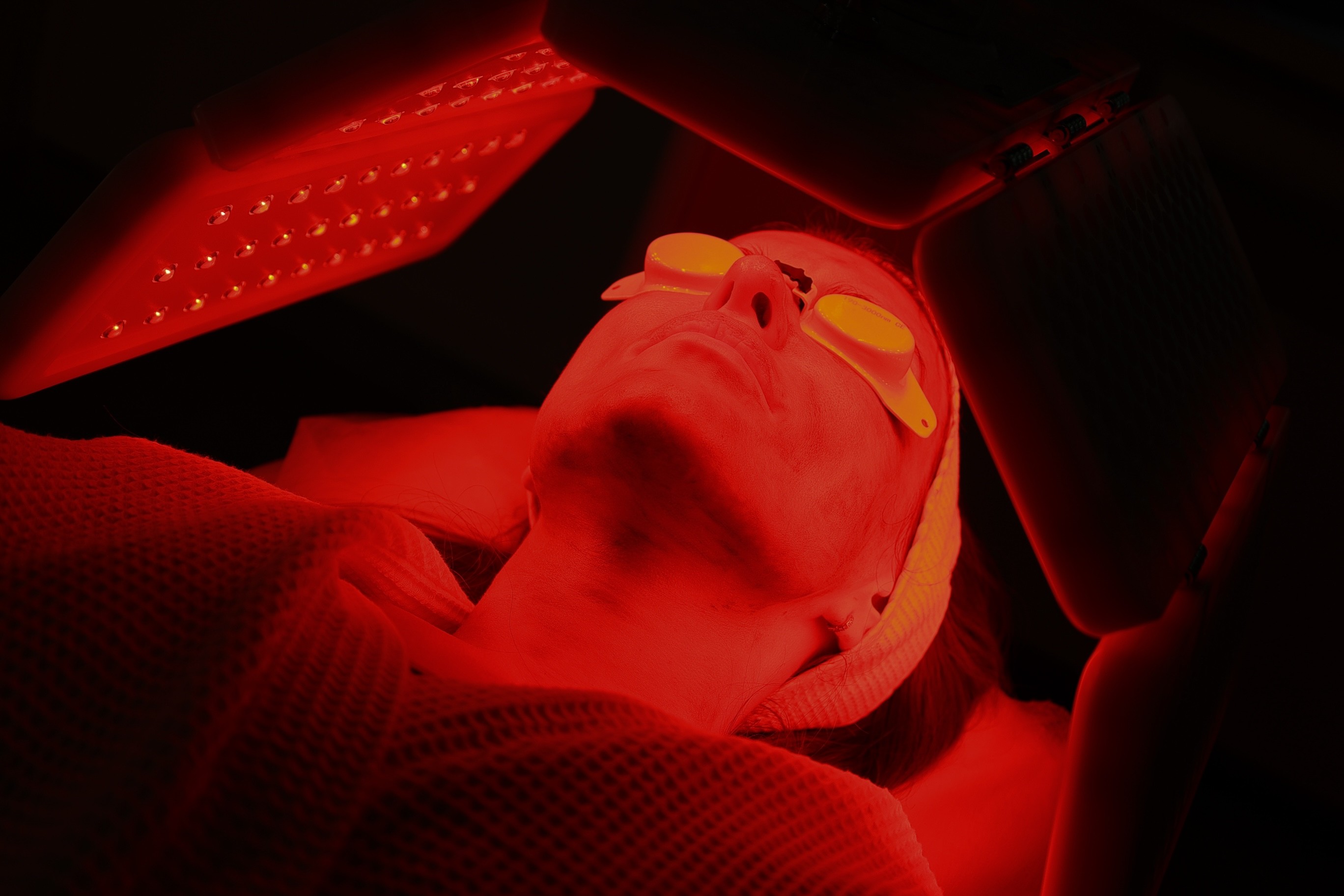 A Lady getting Red light therapy at a med spa