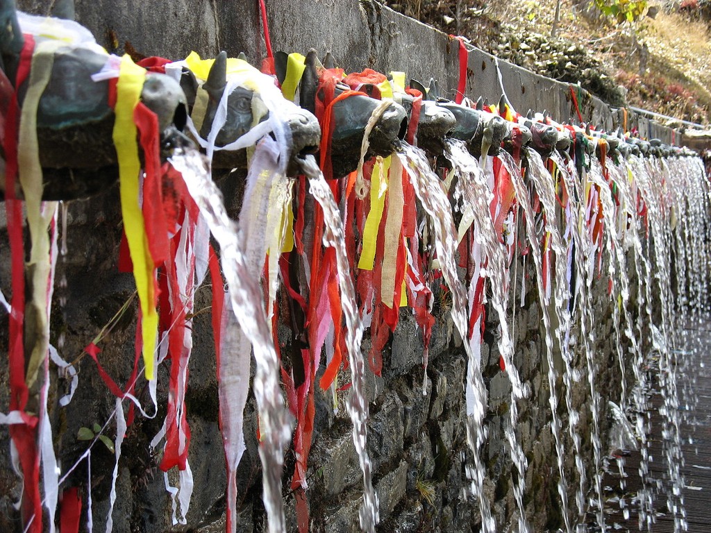 a building with flags flying in front of it