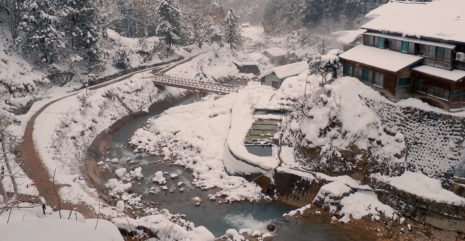 Onsen village buildings under heavy snow near the Snow Monkey Park