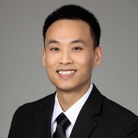 man filming on beach