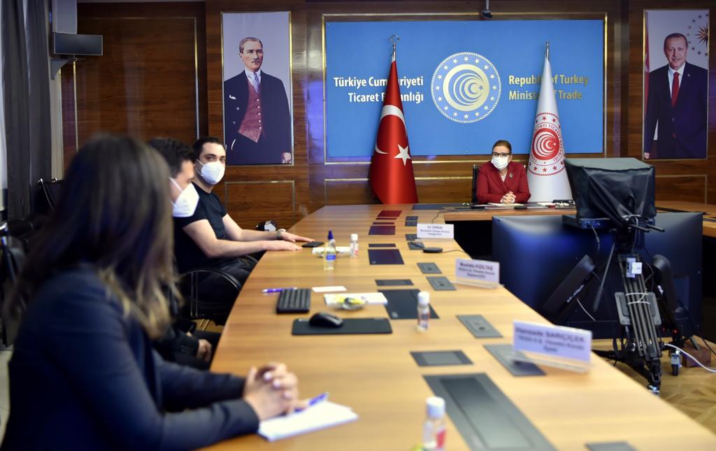 A cell phone sitting on top of a wooden table