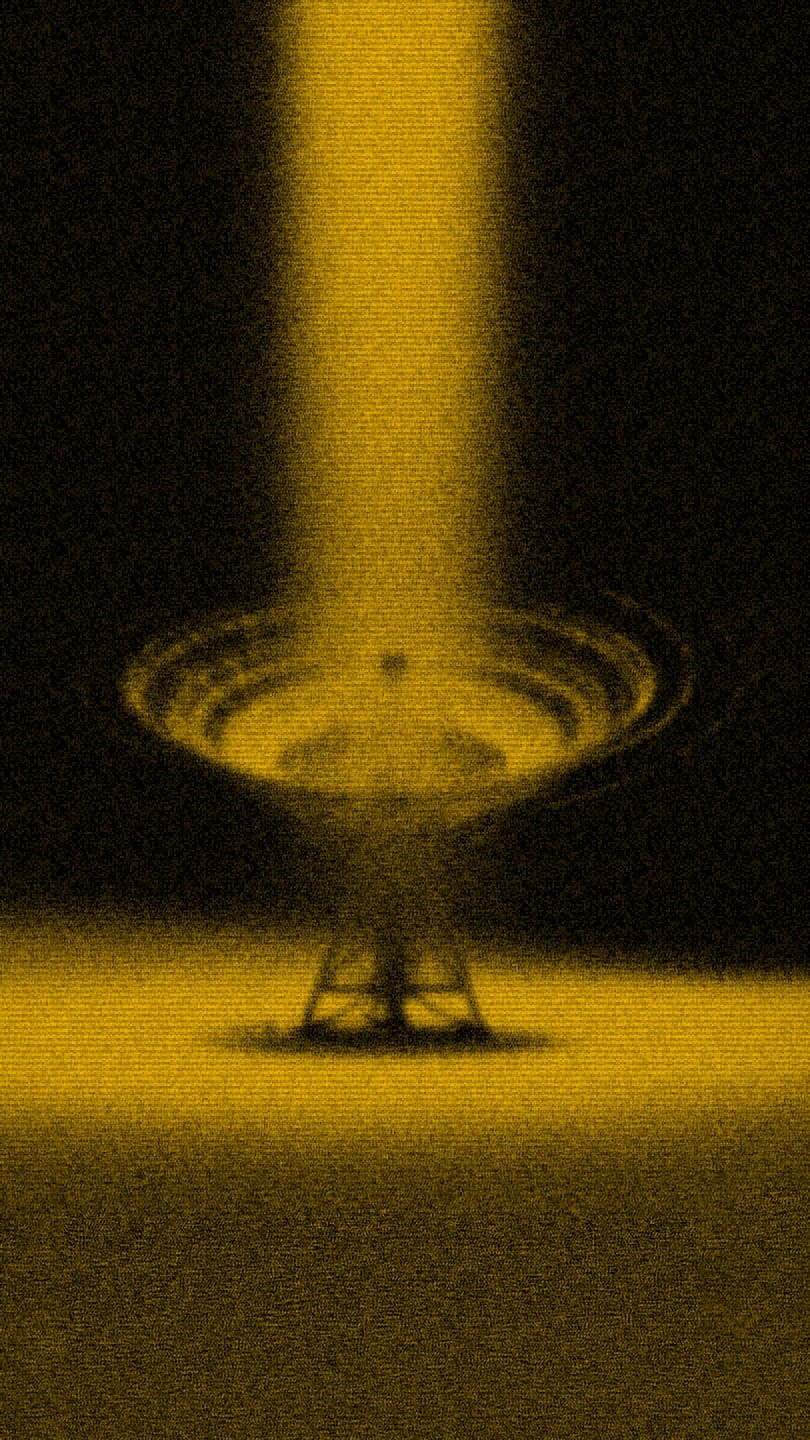 golden energy beam striking a satellite dish in dramatic darkness