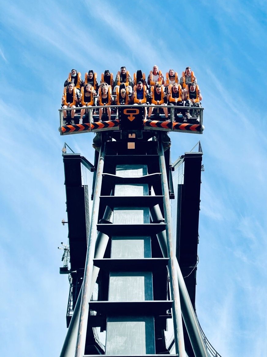 three brown wooden boat on blue lake water taken at daytime
