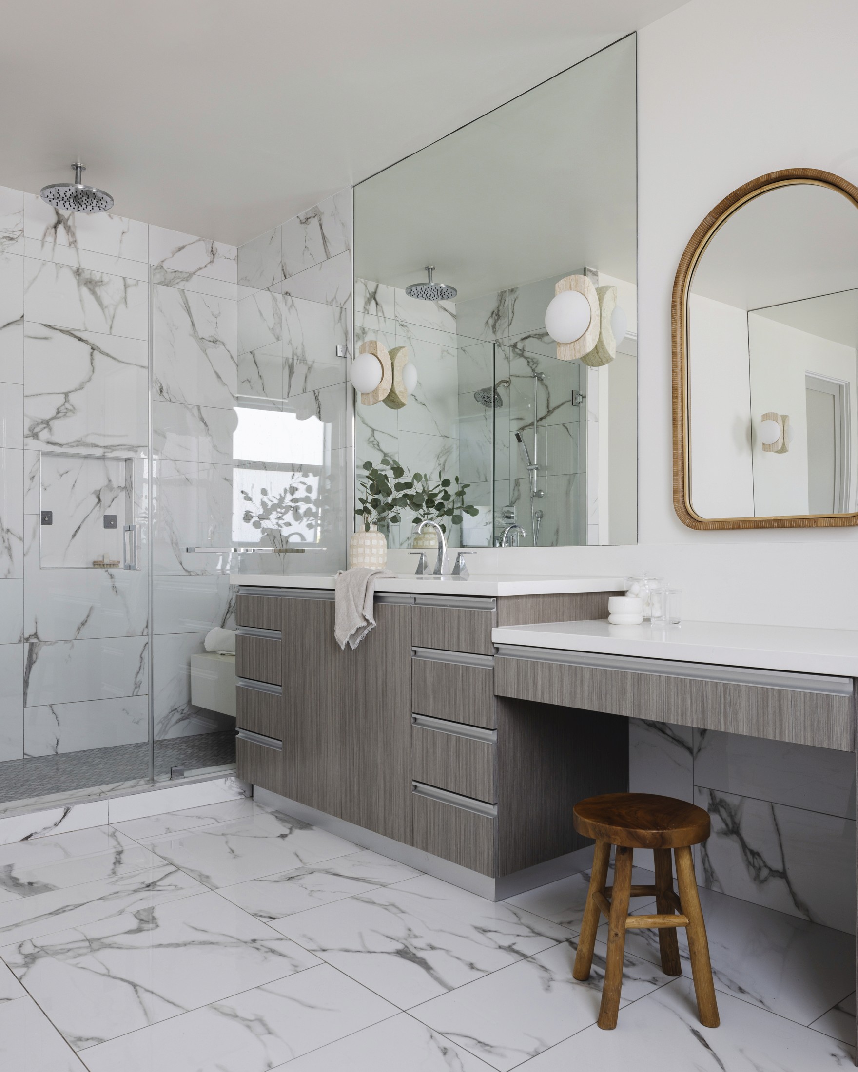View of shower, vanity sink, and additional vanity area