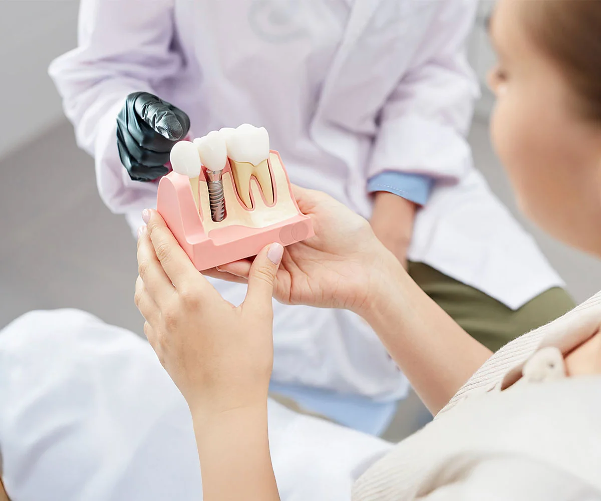 Dental implant consultation with a patient reviewing implant treatment options at an oral surgery office in Fresno, CA