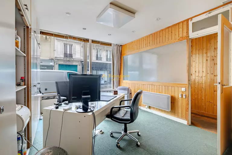 white and brown concrete building near green trees during daytime