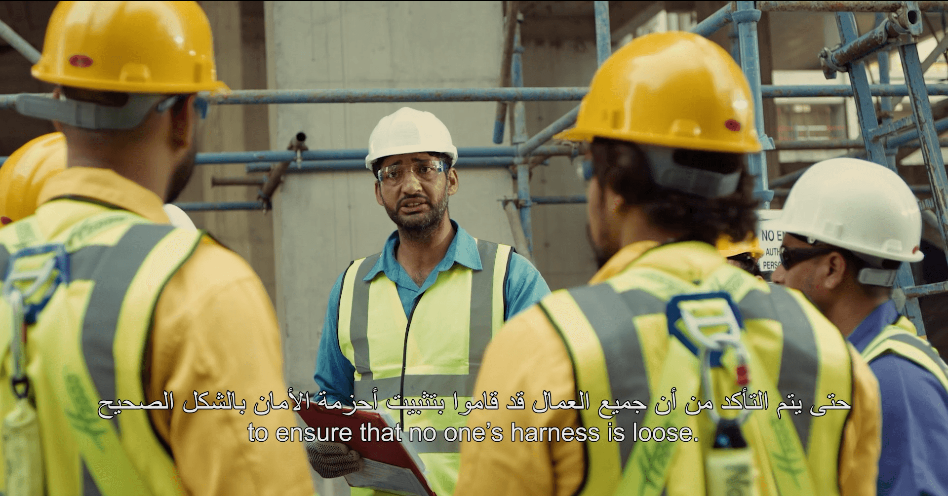 Safety manager briefing construction staff with subtitles in Safety Drama for Working at height training