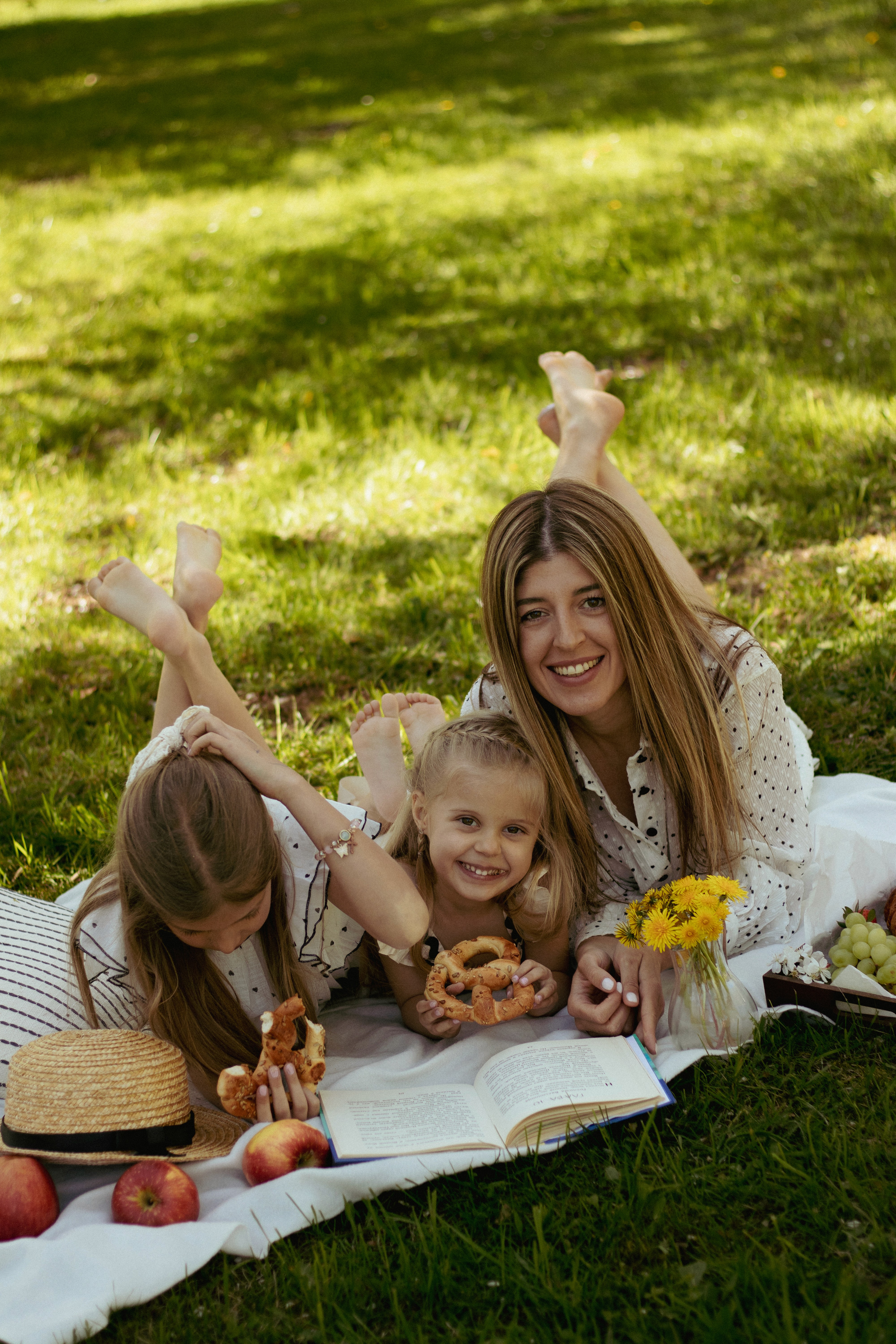 woman holding baby beside man smiling