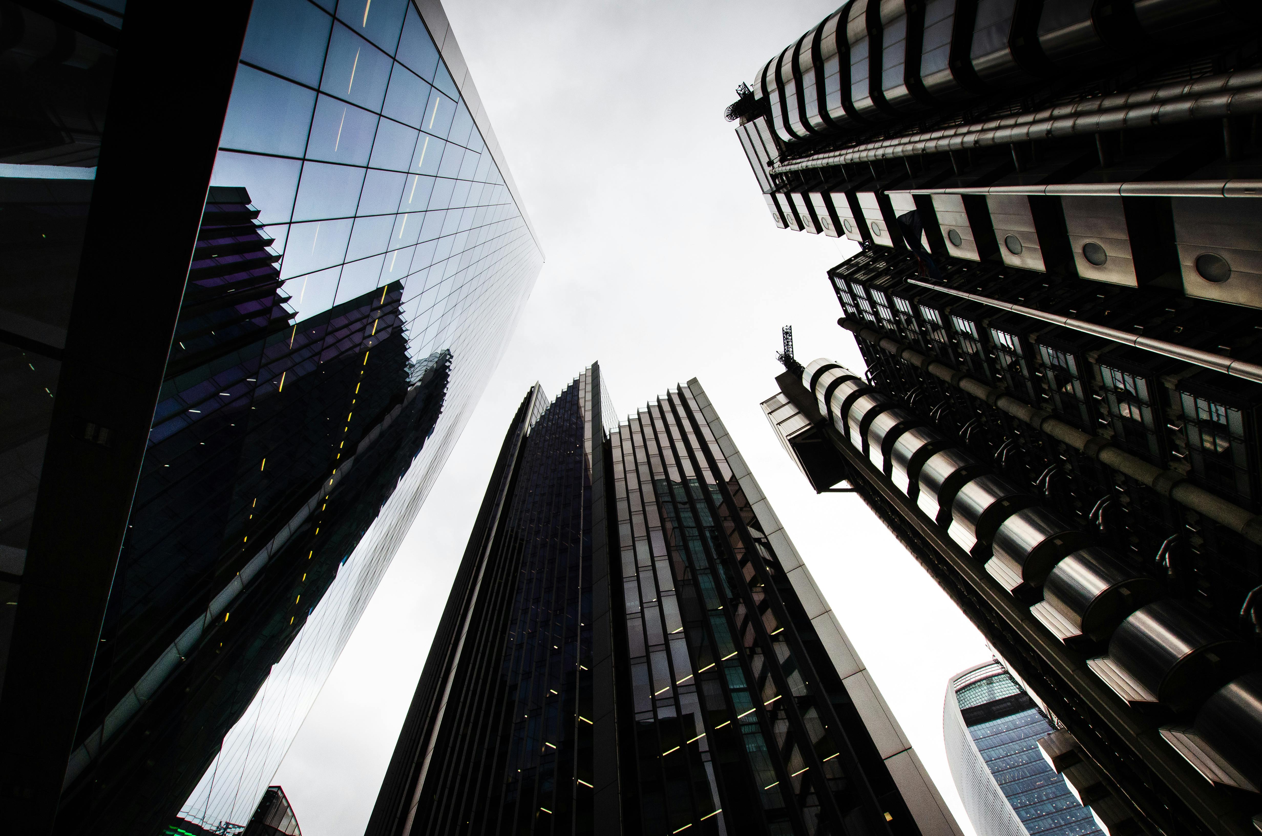 man wearing gray polo shirt beside dry-erase board
