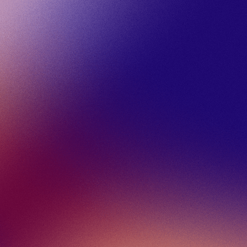 Pink and purple sunset over a sea of clouds and mountains