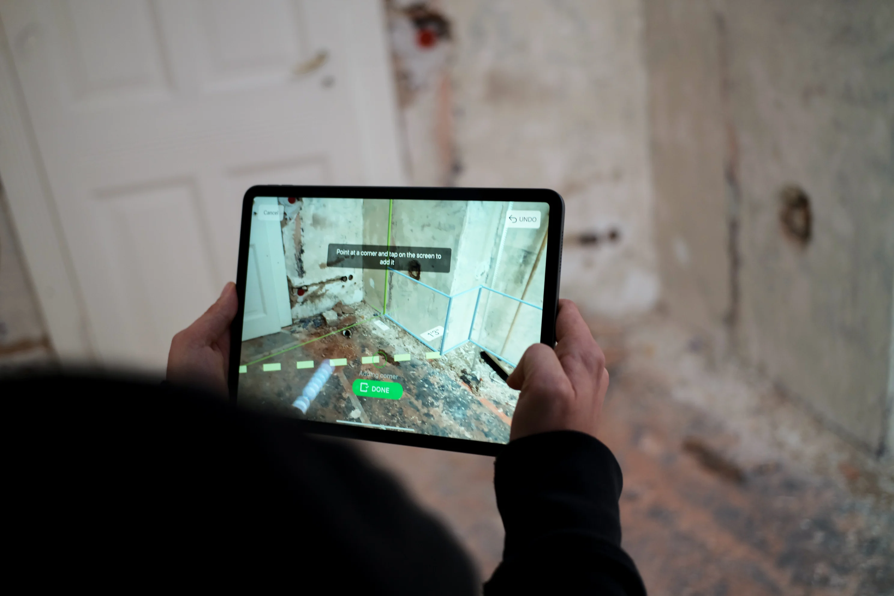 magic plan app used on a tablet to capture room measurements during a site inspection