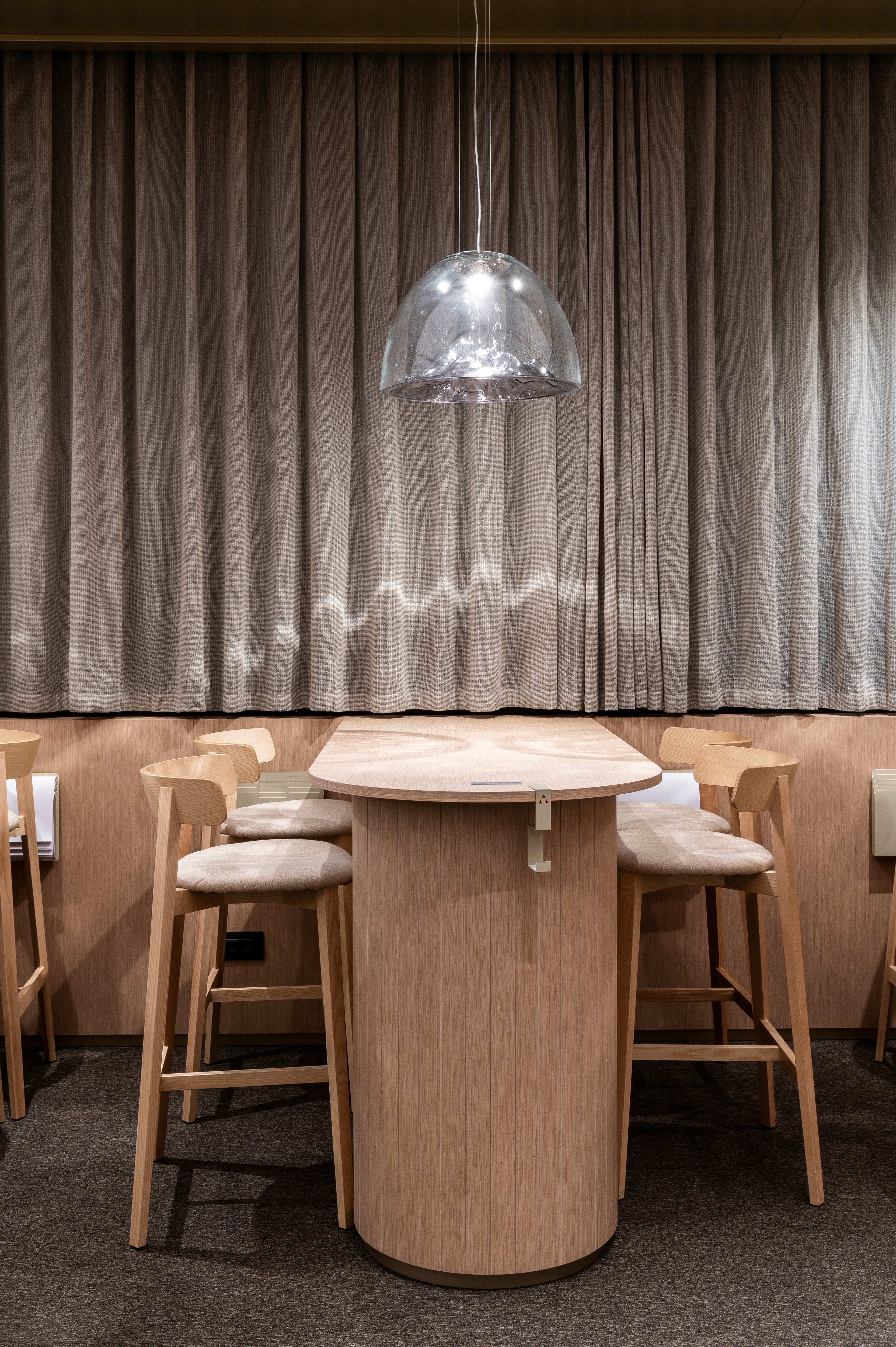 Meeting area table and stools counter Alpina design concept booth Watches and Wonders 2025 fair