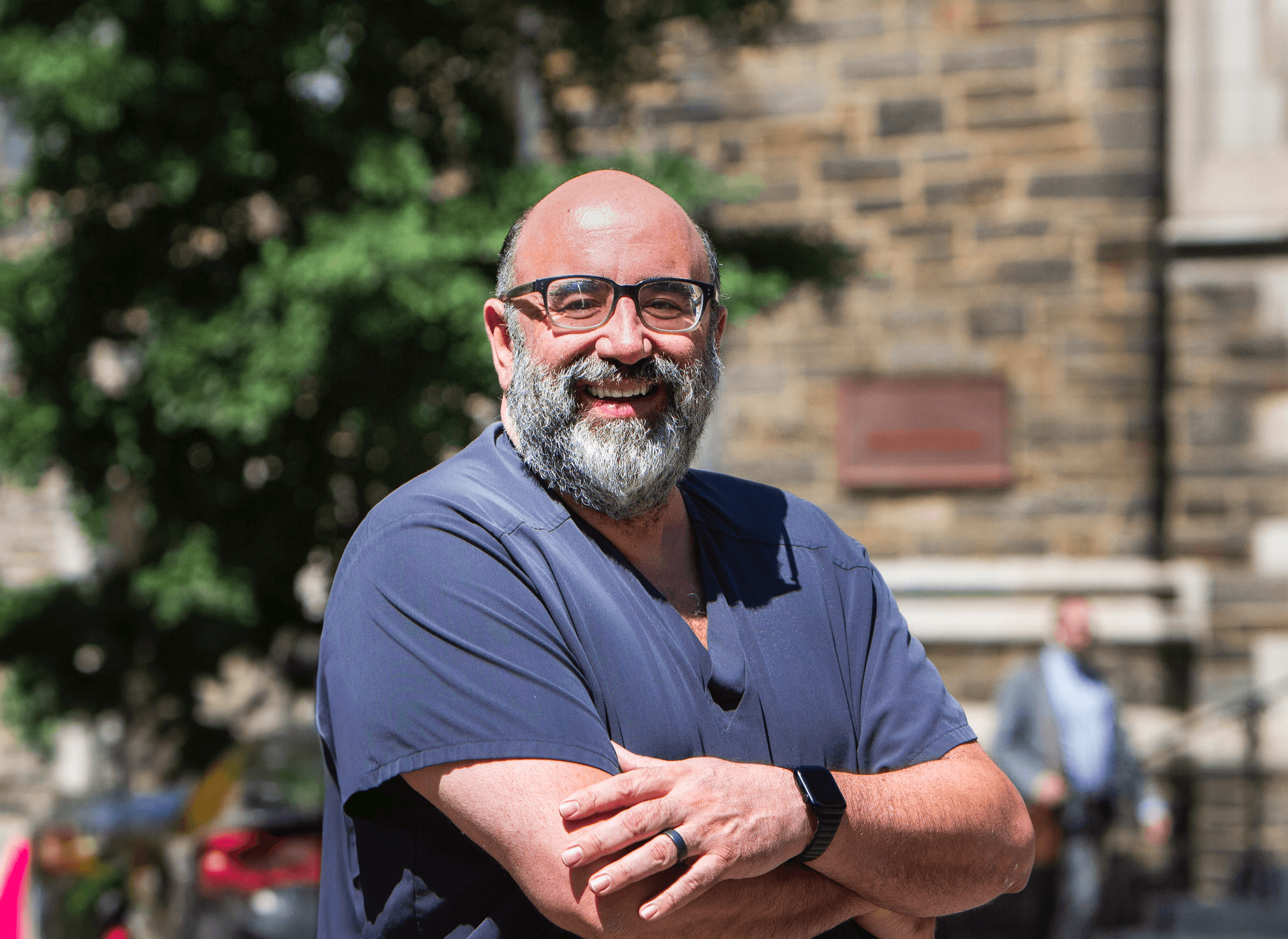 Portrait of a woman with long red hair gently touching her face, looking into the camera
