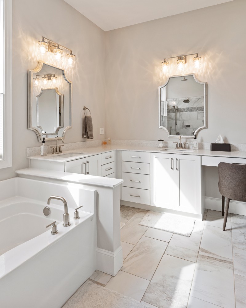 Close-up of a dark green leaf showing its textured surface and central vein against a muted background.