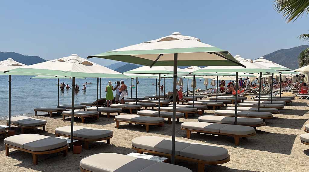 two people looking at a tablet and smiling