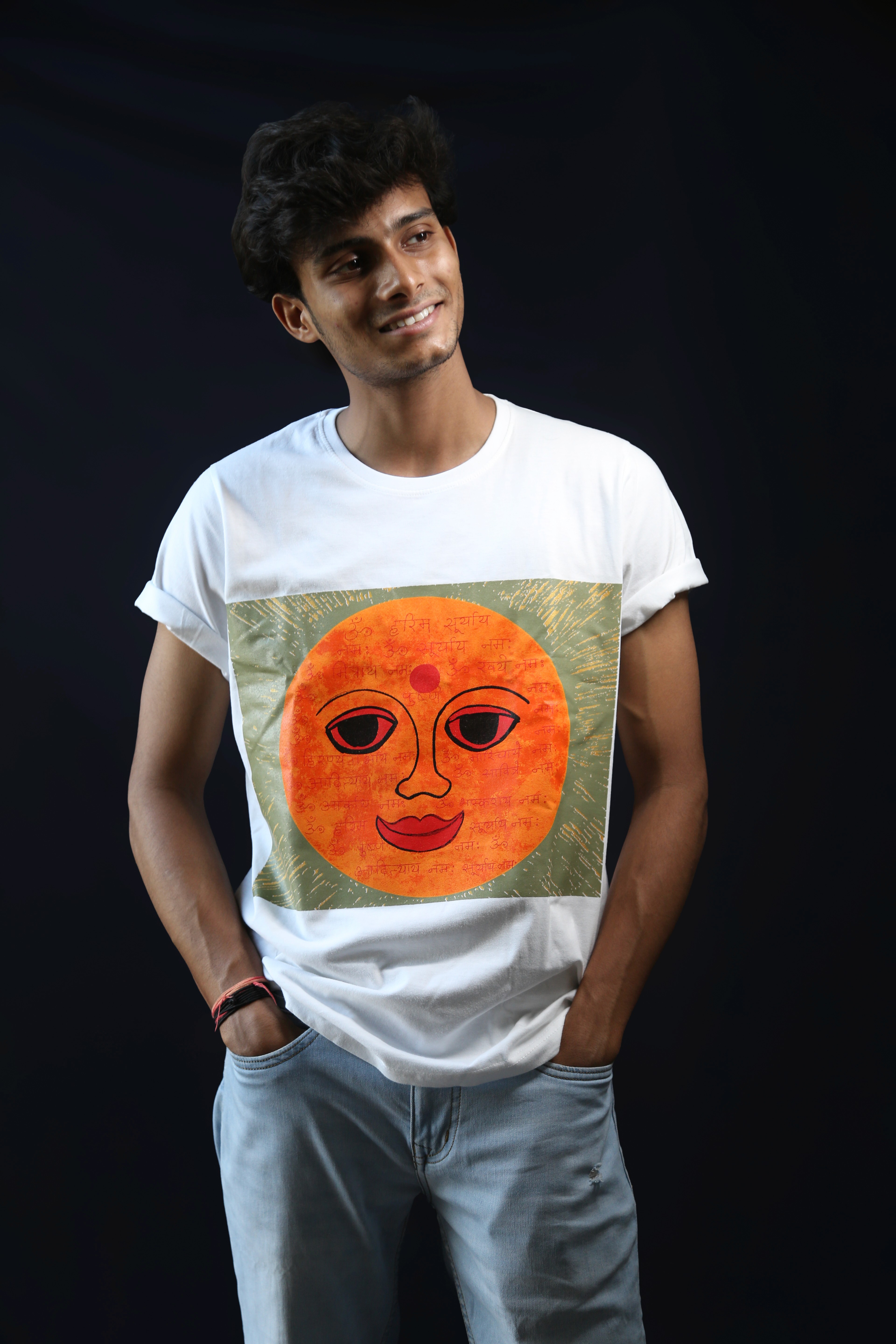 Young man in black leather double-breasted jacket jeans. stand with the support of the white wall