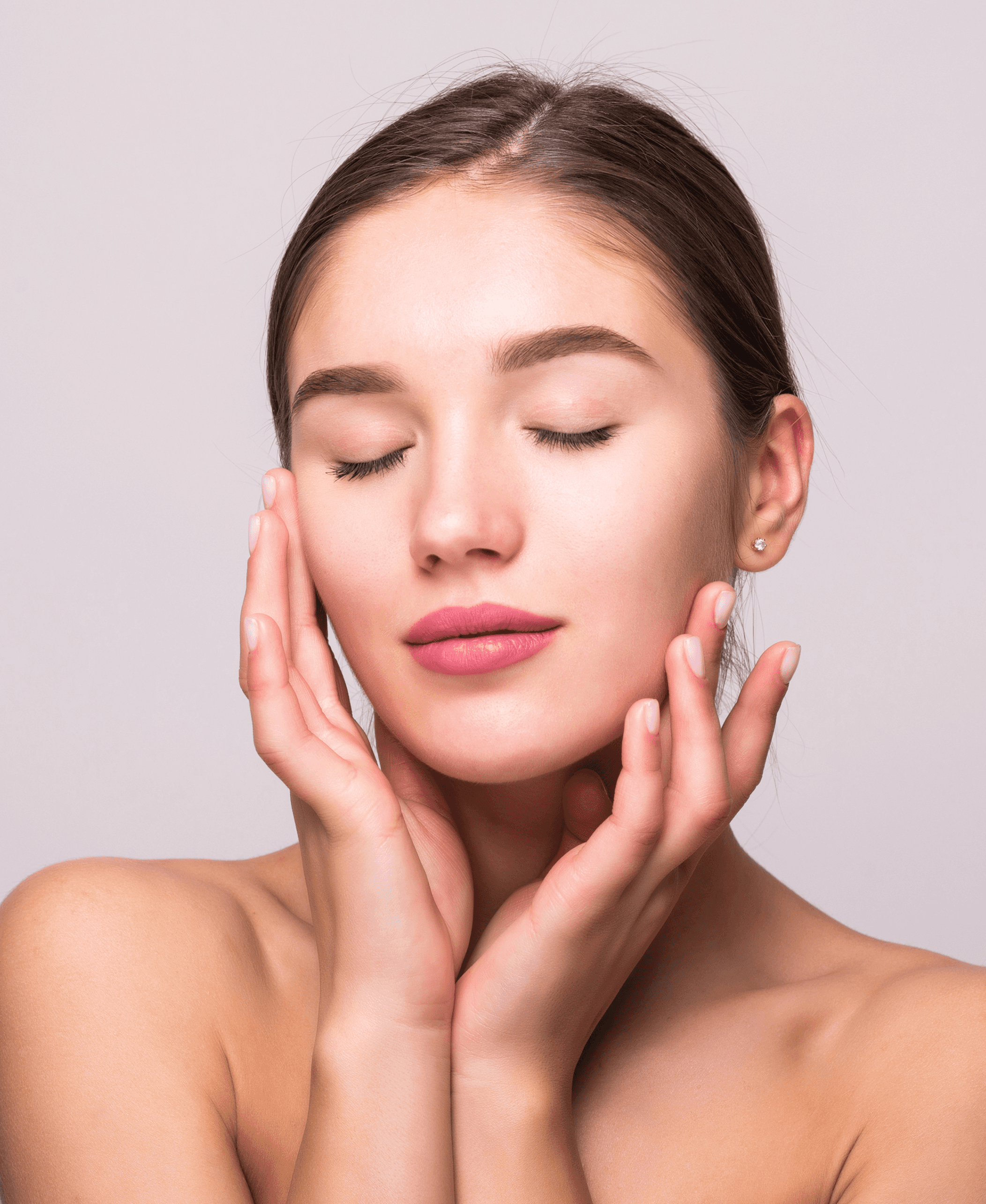 Woman touching her face with eyes closed.