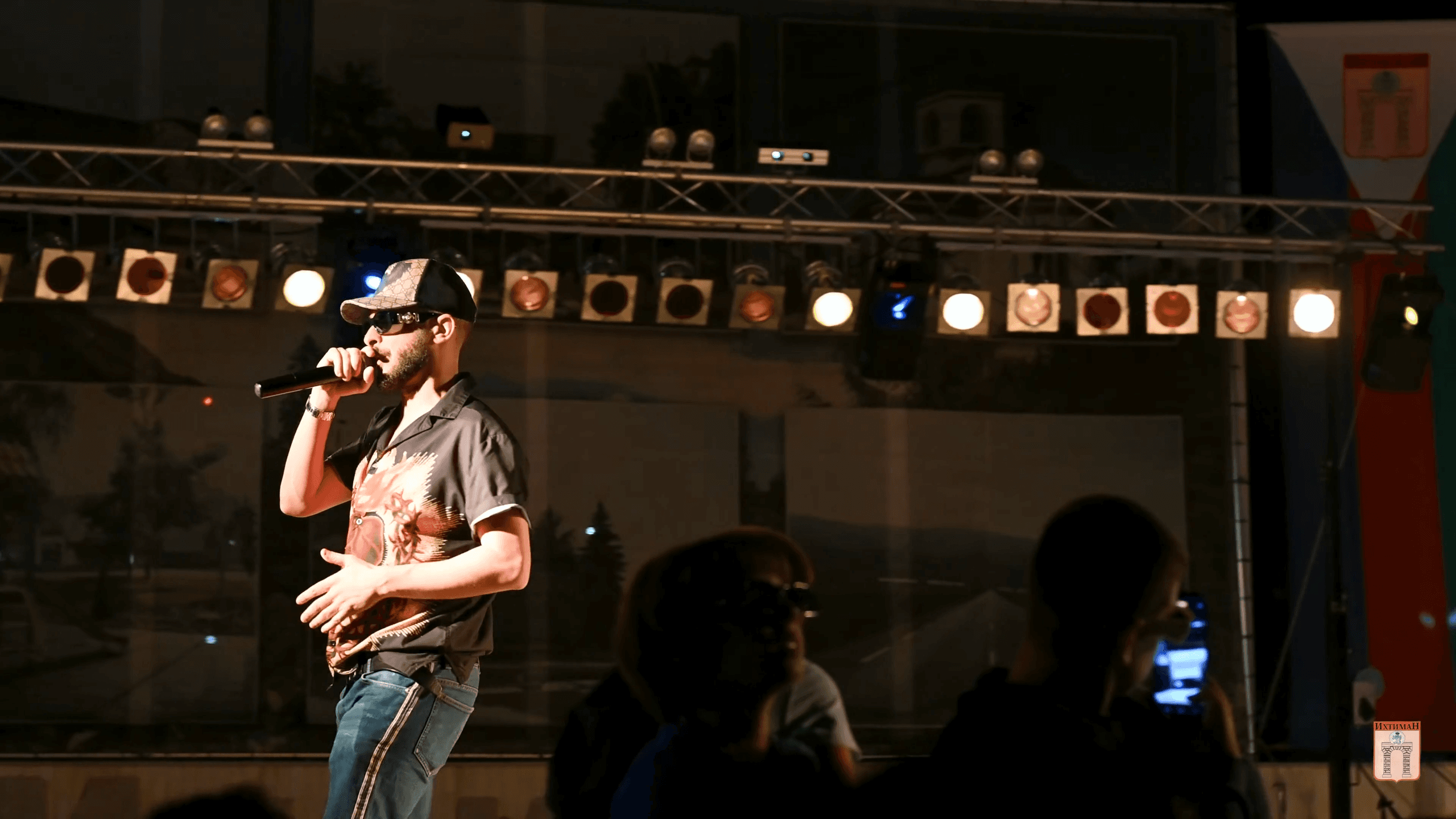 A famous artist sings on stage.