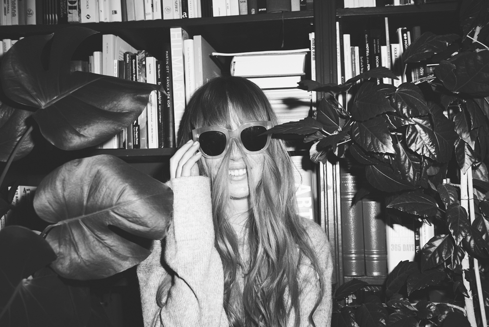 Coffee stored on a shelf in a coffee shop