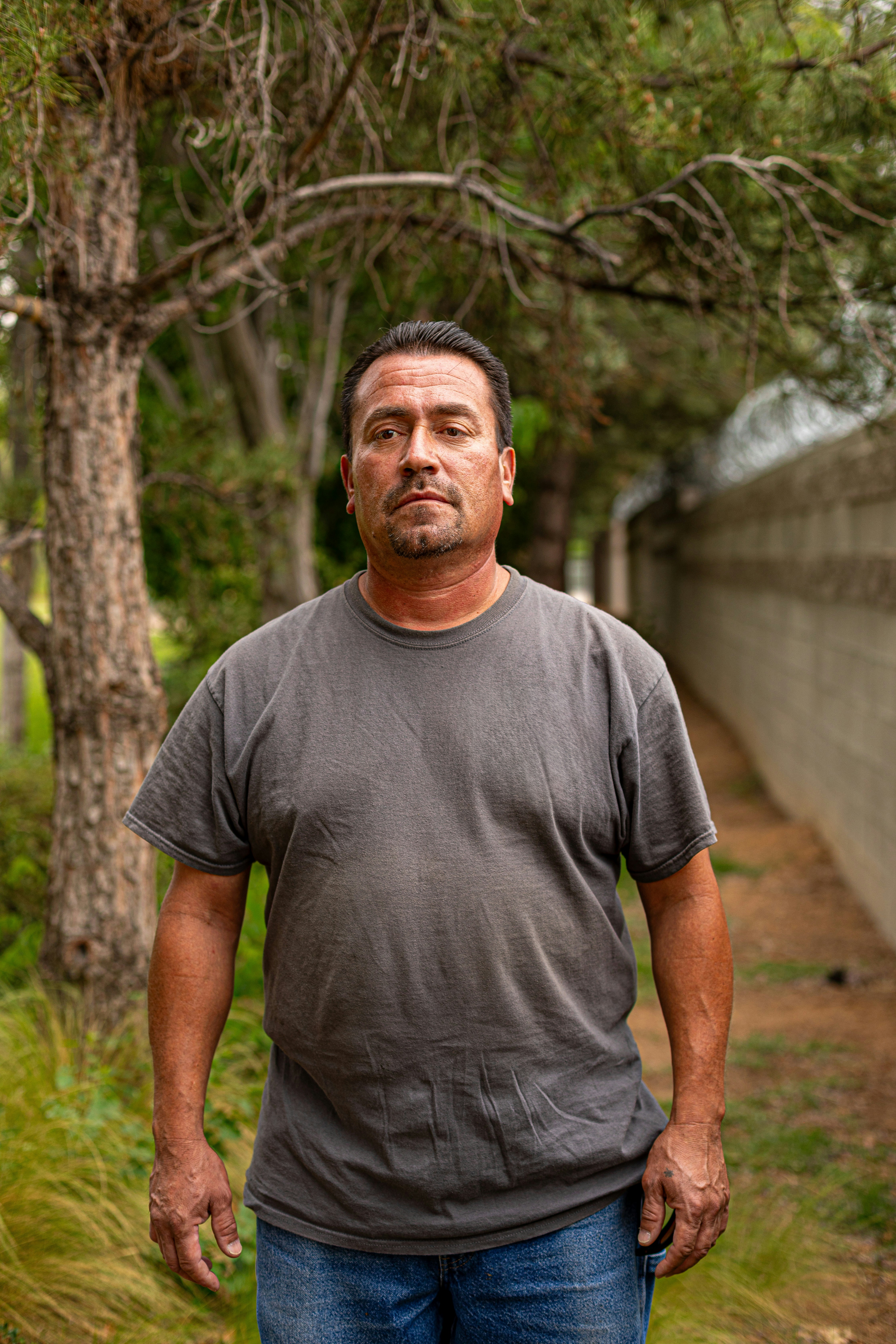 A man standing in the middle of a forest