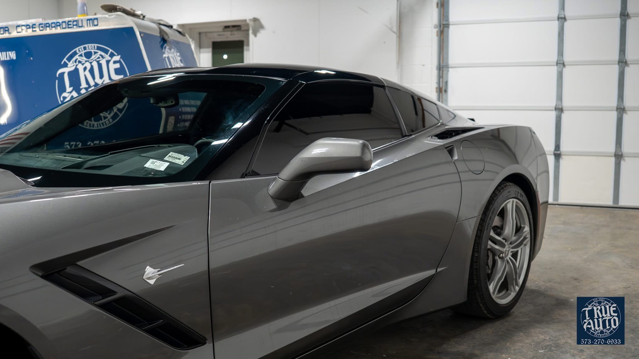 Shiny white car in a garage 