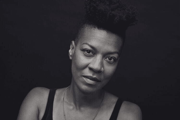 woman in white crew neck shirt smiling