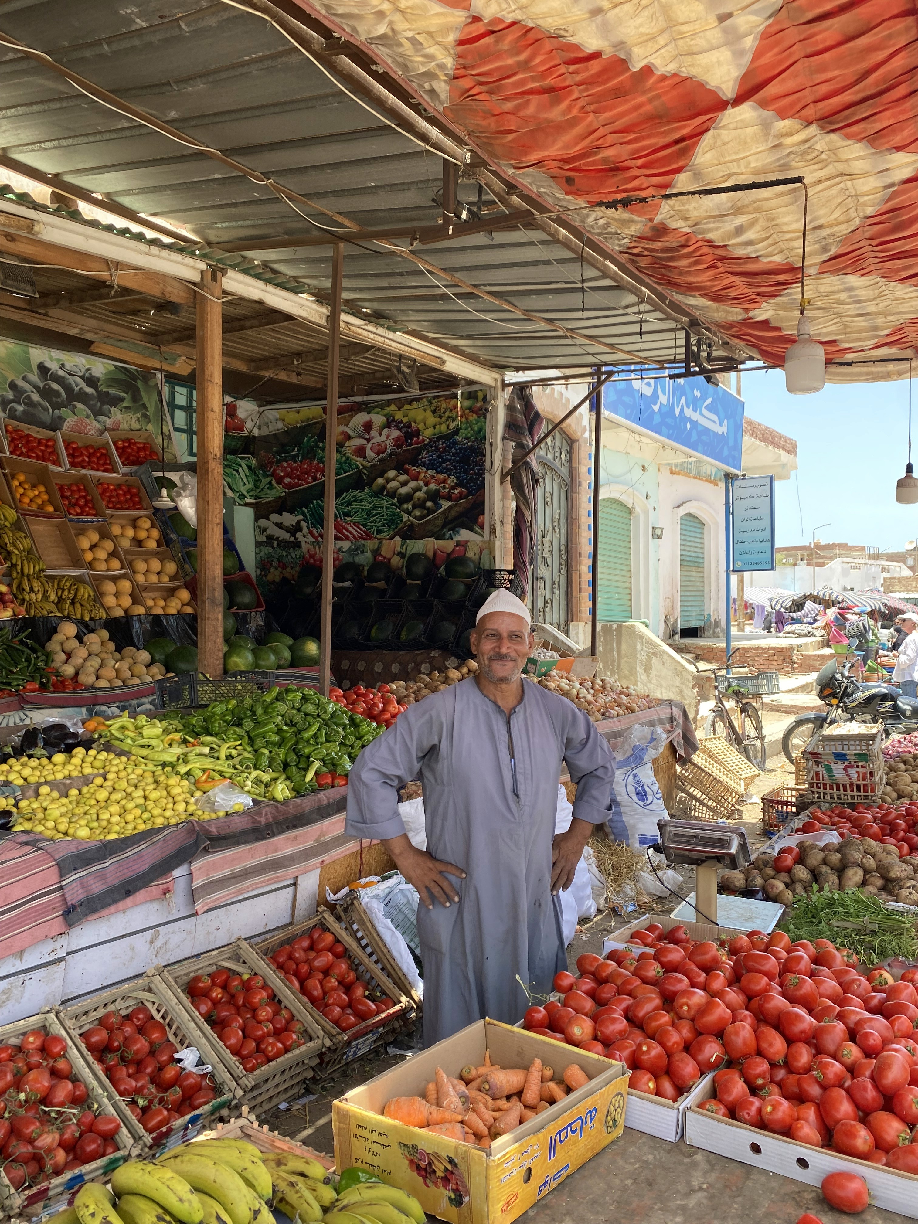 brown wooden lounger near body of water