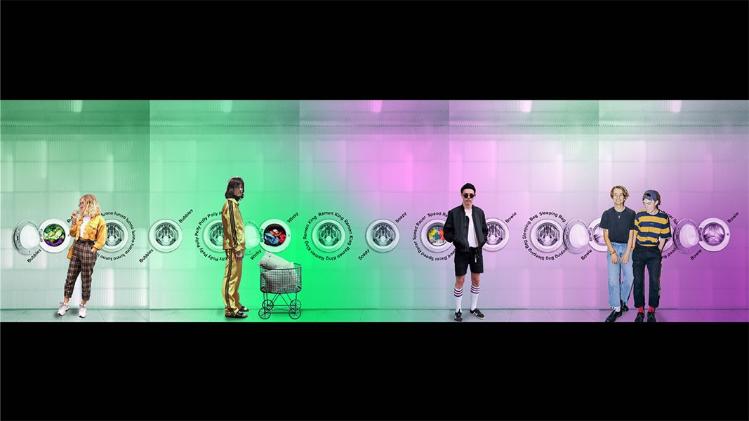 Five figures stand against a gradient green and purple backdrop with circular logos. From left to right: a blonde woman in a yellow sweater and plaid pants; a brown-haired person in a gold suit; a black man in a dark suit and white socks; a man in a dark blue shirt and jeans; and a man in a striped shirt and dark pants. The logos include text such as “Bubbles,” “Bubbles,” “Bubbles,” “Bubbles,” “Bubbles,” “Bubbles,” “Bubbles,” “Bubbles,” “Bubbles,” “Bubbles,” and “Bubbles.”