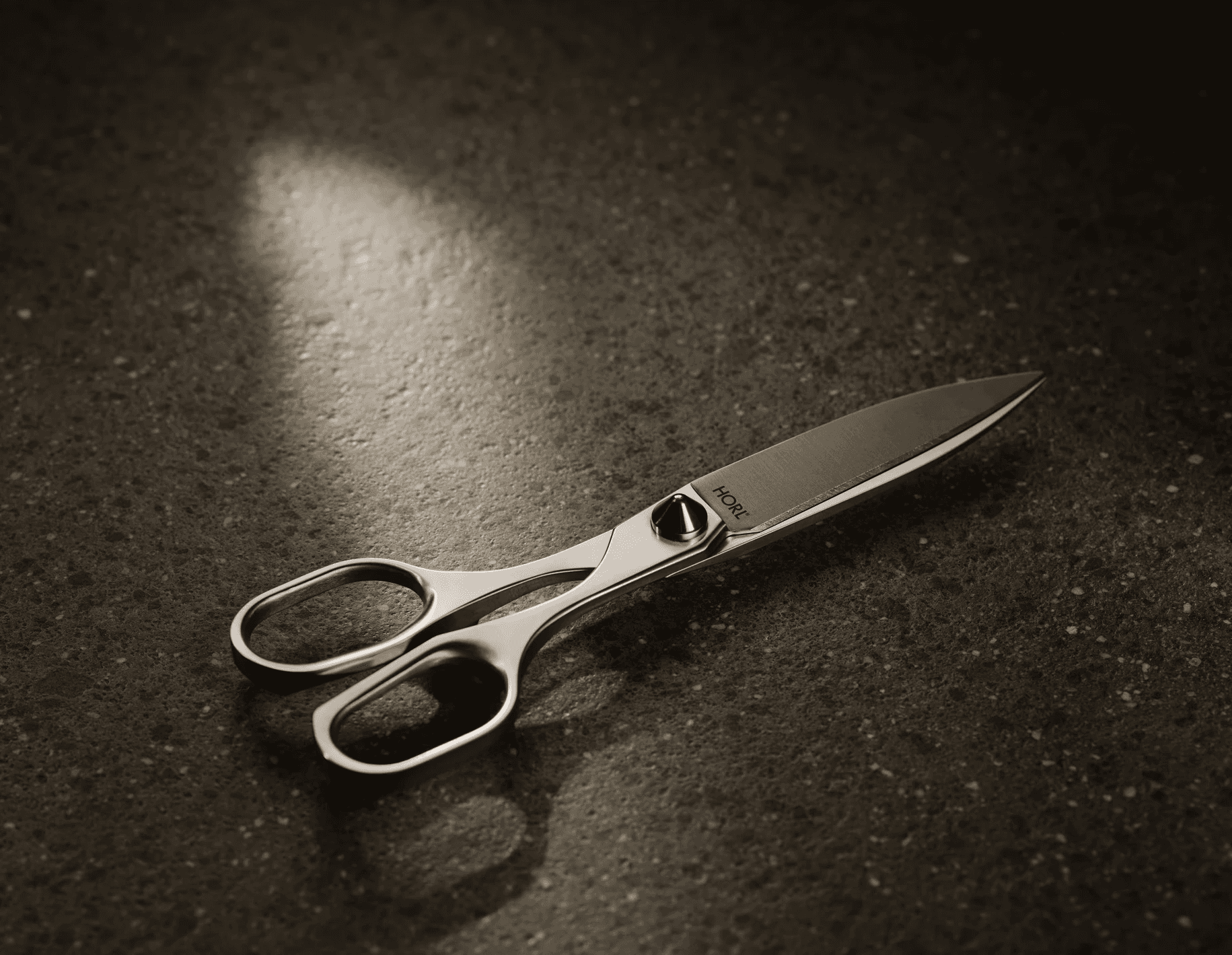 high-quality resharpenable HORL scissors on dark background