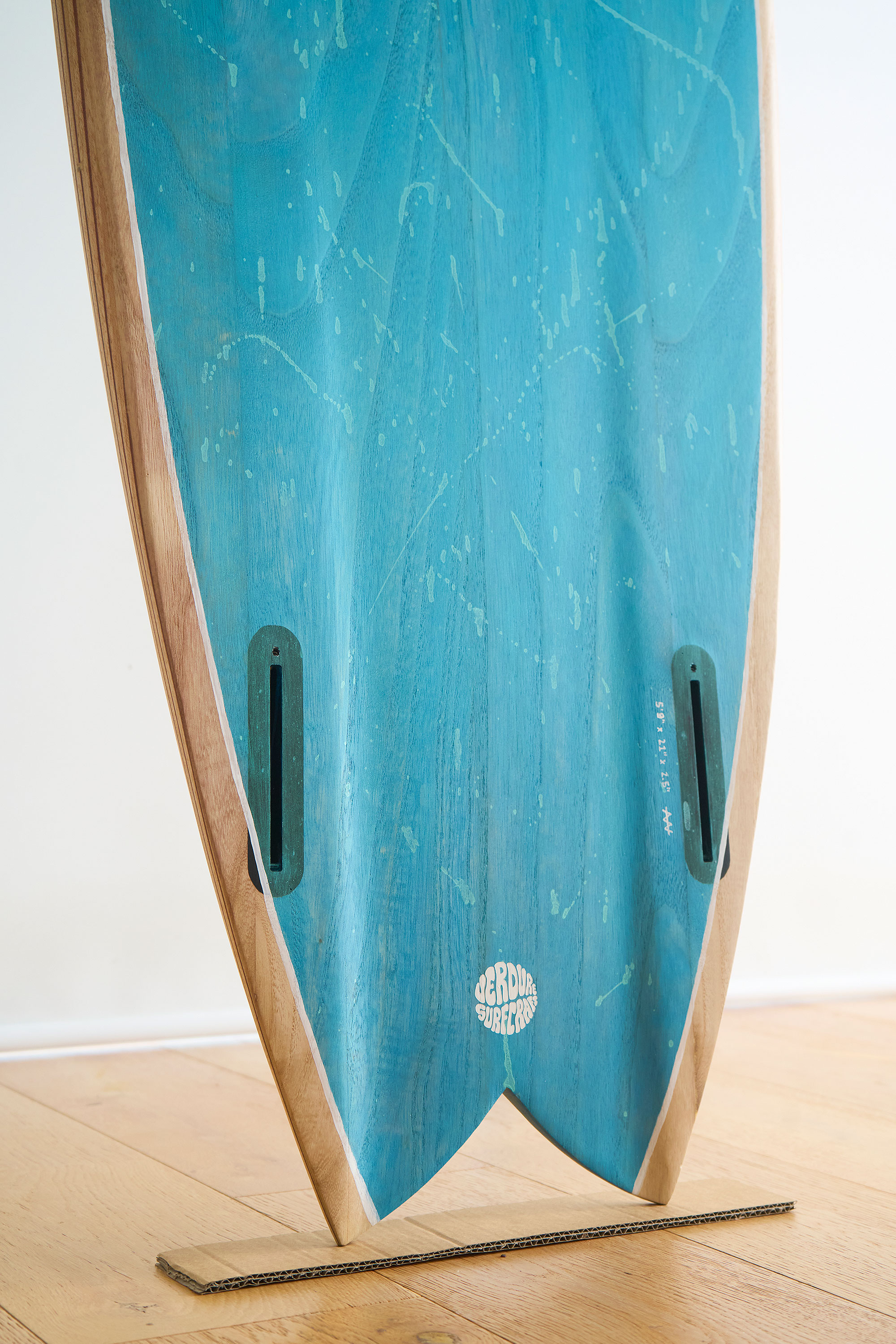 Bottom channel of a wooden surfboard