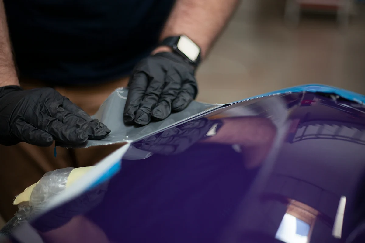 HyperAuto Care Paint Protection Film (PPF) service in a professional auto care workshop